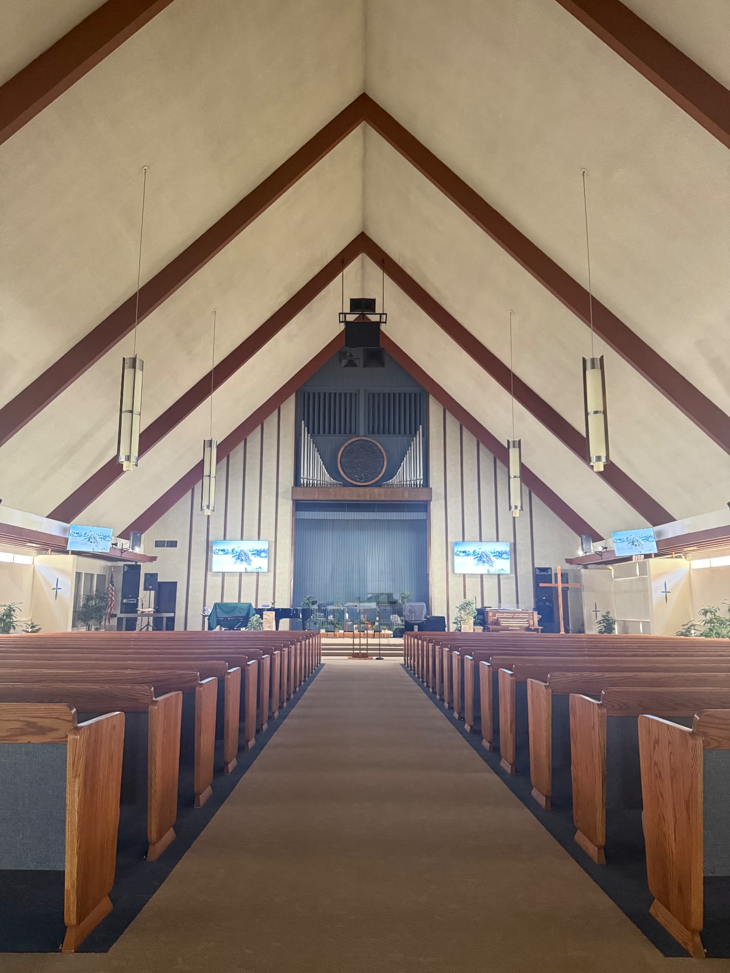 The sanctuary of Alhambra Seventh-day Adventist Church, seen from the center aisle toward the pulpit